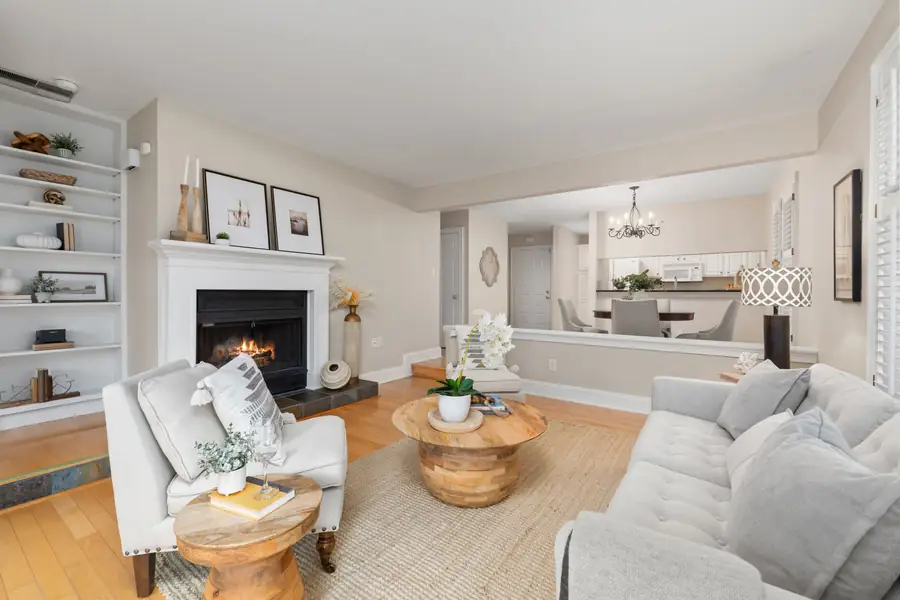 Illustrative photo of a modern fireplace with a flame in a bright living room. Not a McNab gasfitting job.